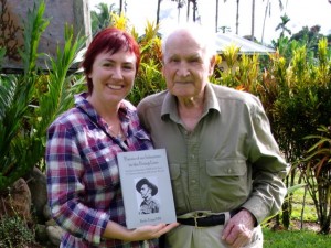 Kerrie Phipps and Bede Tongs in Kokoda with Bede's book.