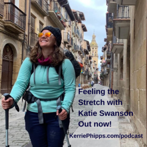 Katie Swanson in a Spanish street walking the Camino Frances. Wearing hiking clothes and a backpack looking up at the buildings. Text says, Feeling the stretch with Katie Swanson. Podcast Out Now